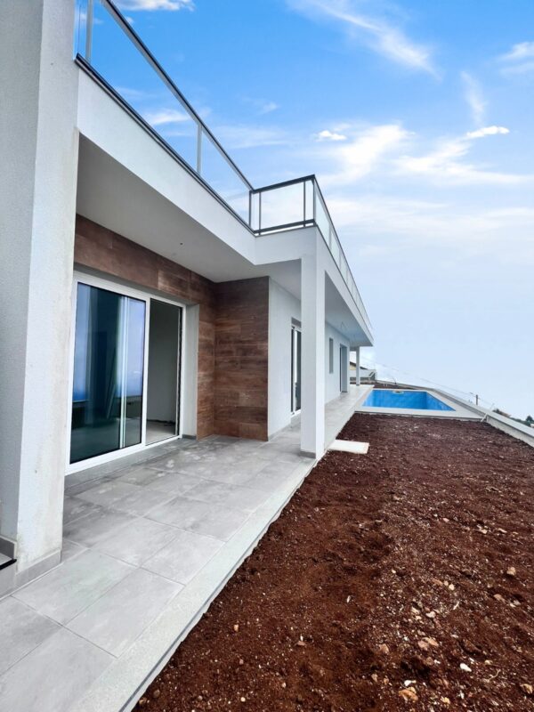 House newly built in Canhas Madeira Island. View of House and pool.