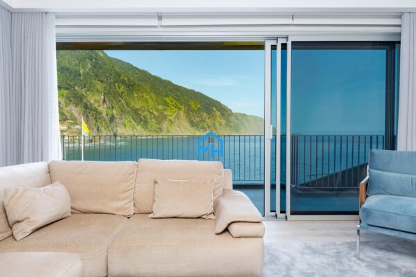 Living Room with view of the bay through large glass sliding doors